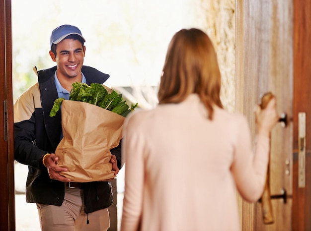 woman door courier with groceries delivery online shopping ecommerce distribution food female customer male dispatch worker paper bag product order home parcel 590464 367380